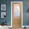 Glazed bespoke oak veneer interior door design